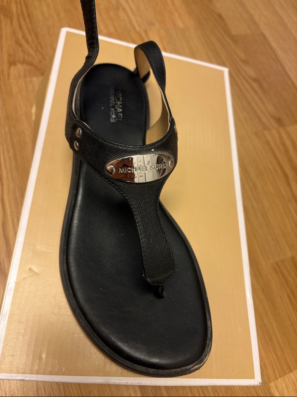 Michael Kors Black Leather T-Strap Sandal with Silver Logo Accent